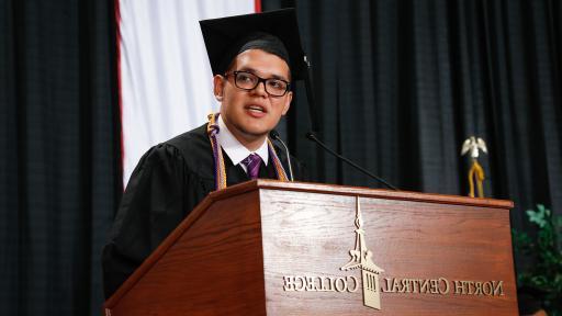 International student speaking at graduation